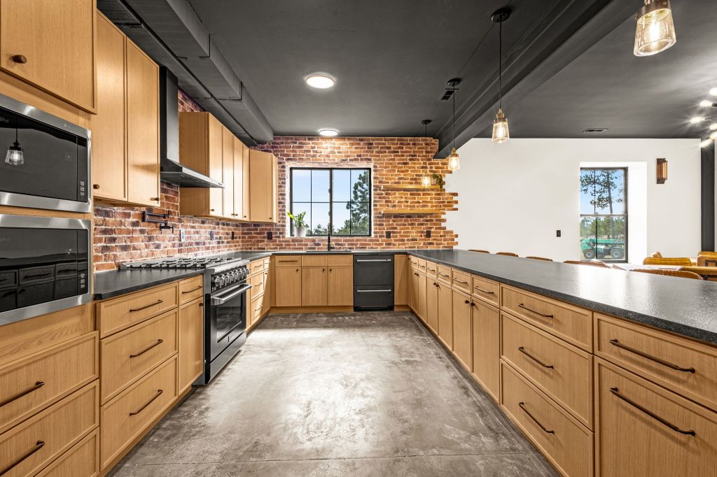 Kitchen area with pristine appliances. 